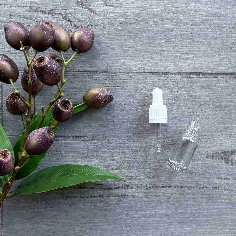 10ml Clear Thick Glass Bottle with White Dropper nest to bottle