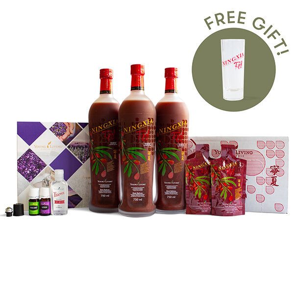 Three bottles of NingXia Red with a free gift container on a white background