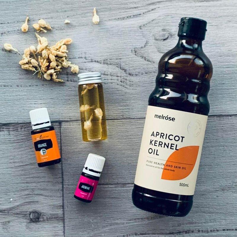 Apricot Oil - 500ml- Short best before - also orange essential oil and a bottle of jasmine oil and a clear bottle with a silver cap top.