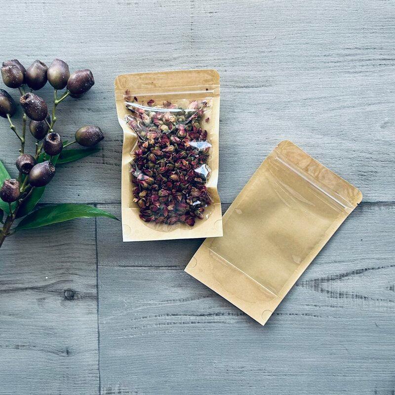 clear front stand up pouch with kraft back rose buds