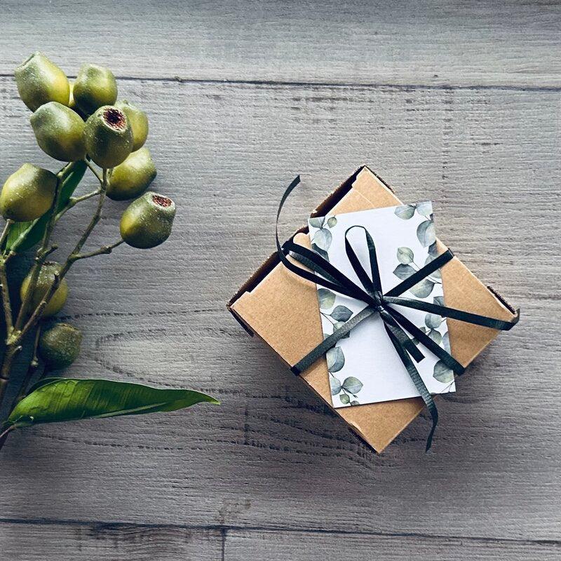 gum leaf gift tag on Kraft box with black curling ribbon