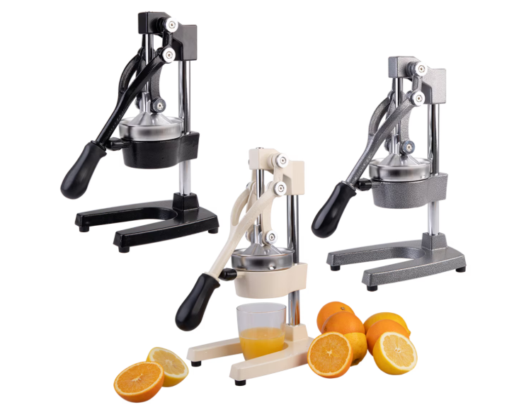 Two manual citrus juicers shown on a white background, one black and one beige, with sliced oranges and a glass of orange juice placed in front of the center juicer.