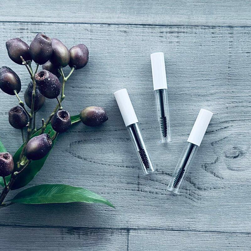 10ml mascara bottle and white and black cap and brush