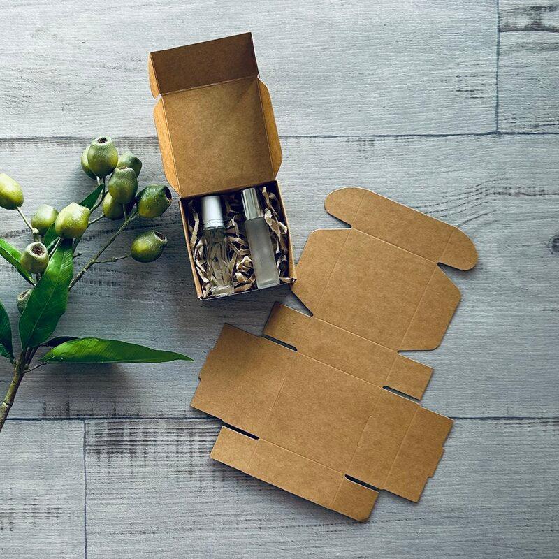 mini kraft gift box, 1 x flat and one with roller bottle inside