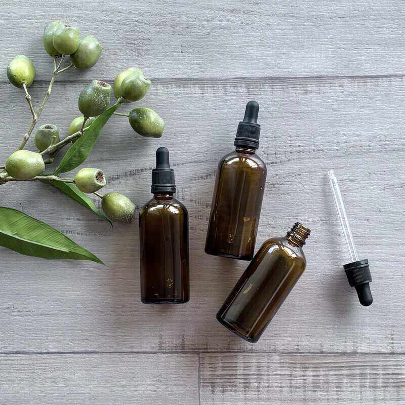 100ml Amber Glass Bottle with Black Dropper dropper next to bottle x 3