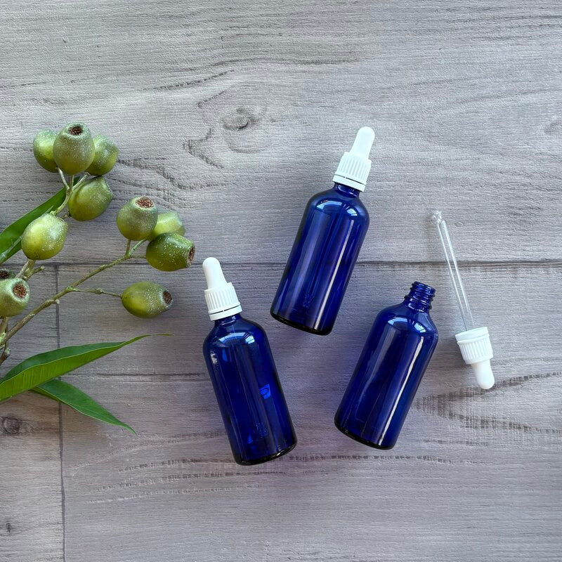 100ml blue glass bottle with white tamper evident dropper x 3 one with dropper next to bottle