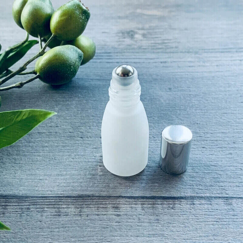 white tara roller bottle with silver perfume lid