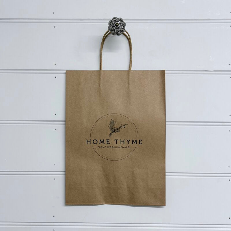 printed logo on brown handle bag