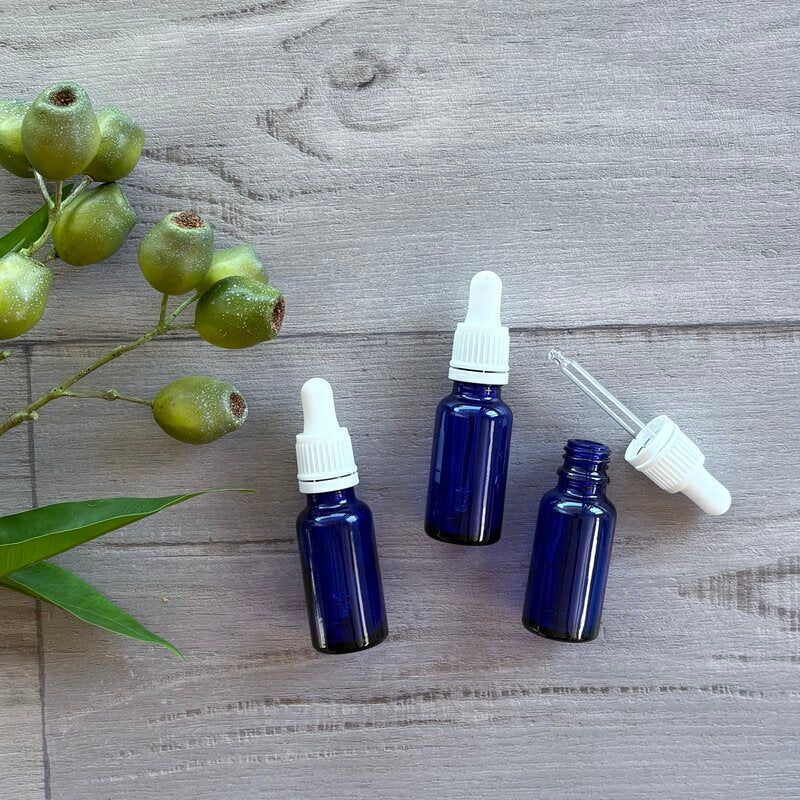 20ml blue glass bottle with white tamper evident dropper x 3 one dropper out next to bottle