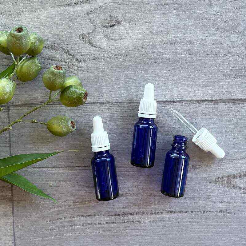 20ml blue glass bottle with white tamper evident dropper x 3 one dropper out next to bottle