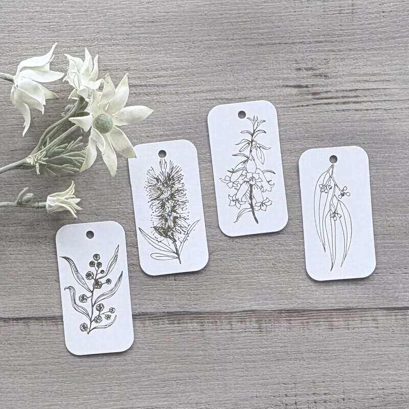 White cardboard botanical gift tags with gold printing, featuring bottlebrush, wattle, gum leaf and honeysuckle designs, supplied in a pack of 20.