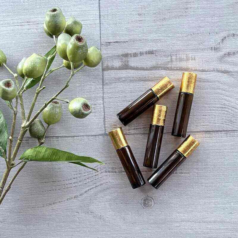 10ml Amber Roller Bottle with Brushed Gold Lid - 5 Pack lid on