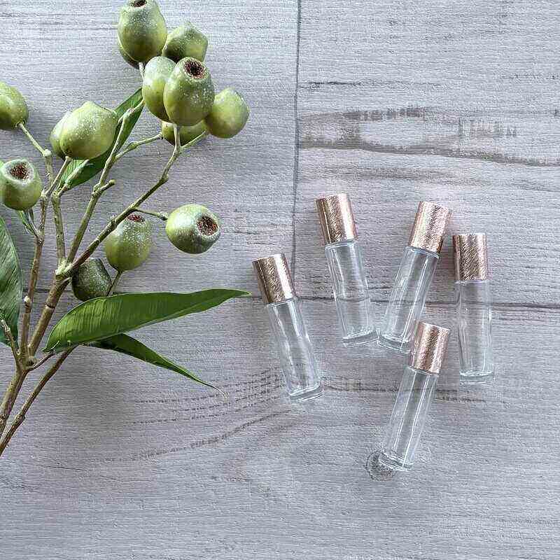 10ml Clear Roller Bottle with Brushed Rose Gold Lid - 5 Pack lids on