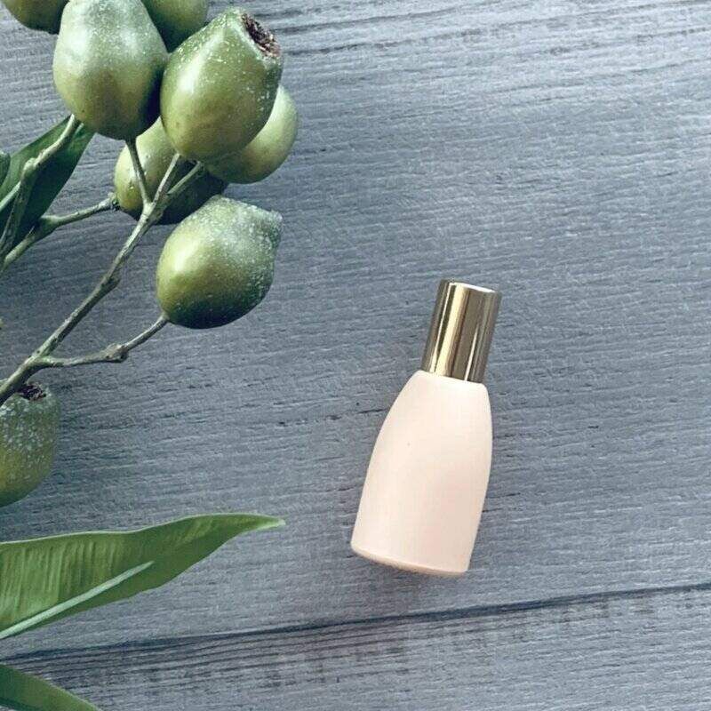 Peach essential oil roller bottle