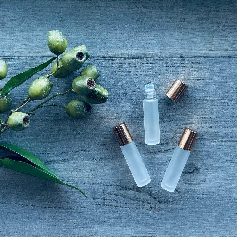 10ml frosted glass roller with gold perfume lid x 3 one lid off