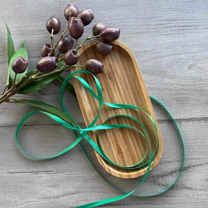 6mm emerald green double faced satin ribbon on bamboo platter