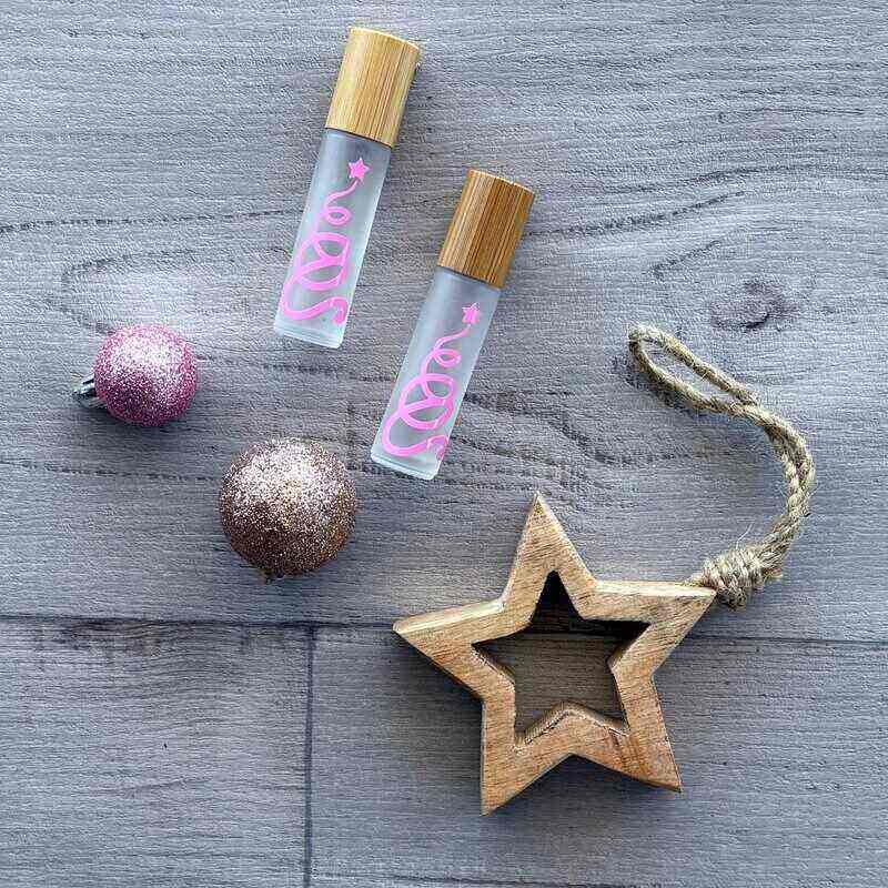 Pink Christmas Tree label on frosted roller bottle - centaur packaging