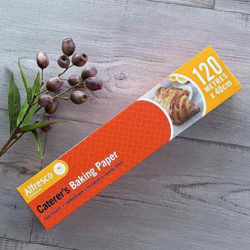 Alfresco Caterer's Baking Paper roll on a wooden surface with a branch of berries - centaur packaging