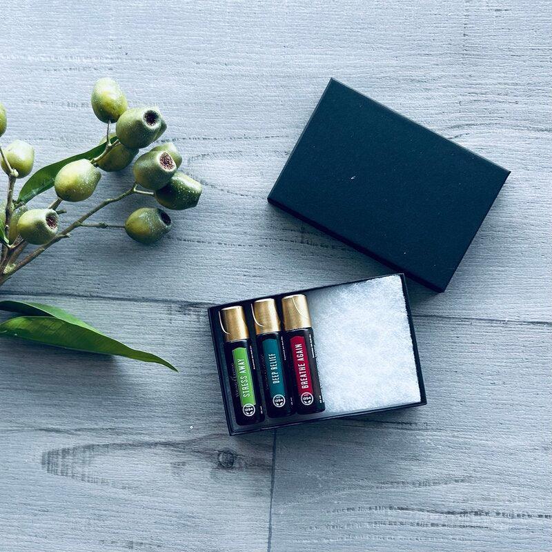 rectangle black jewellery box with cotton fill and essential oil bottles