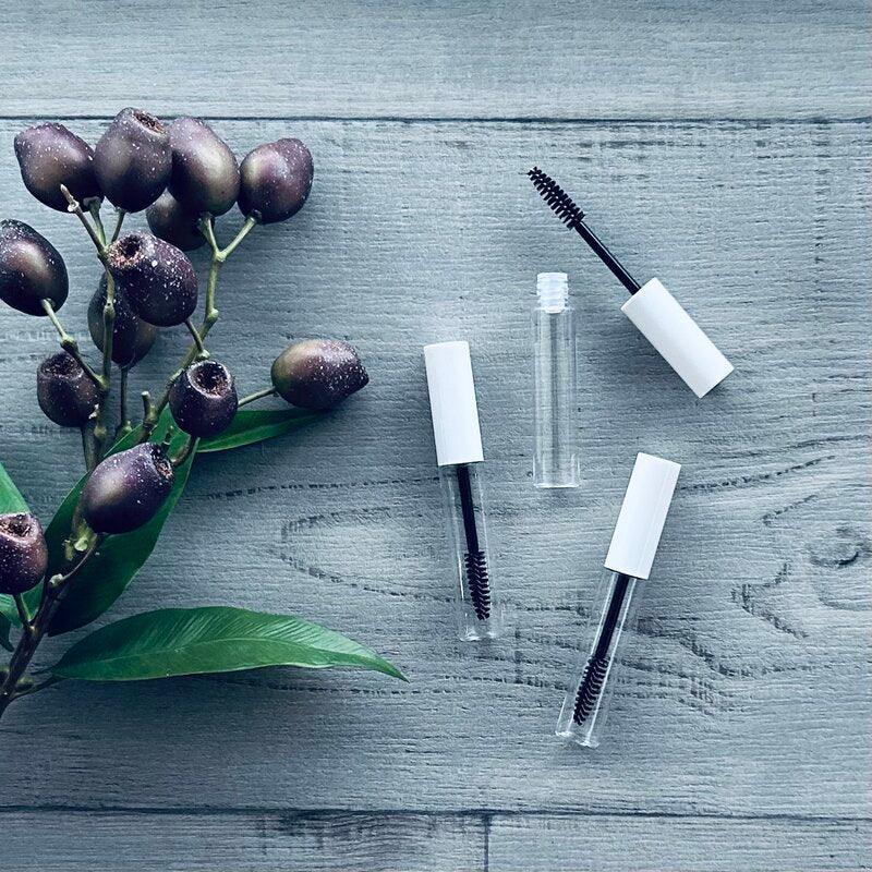 empty mascara wand and bottle white and black x 3