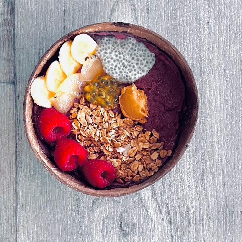 coconut shell owl with acai, fruits and oats filling