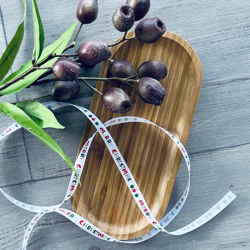 10mm x 20mt grosgrain white ribbon with red, green & old merry Christmas print & gum nuts