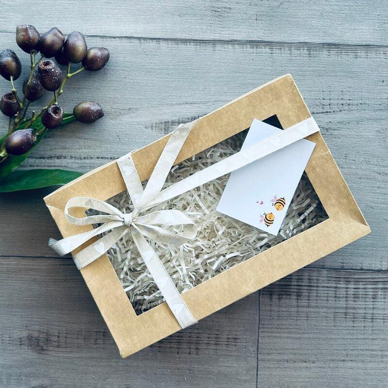 kraft hamper with bees in love tag and heart ribbon