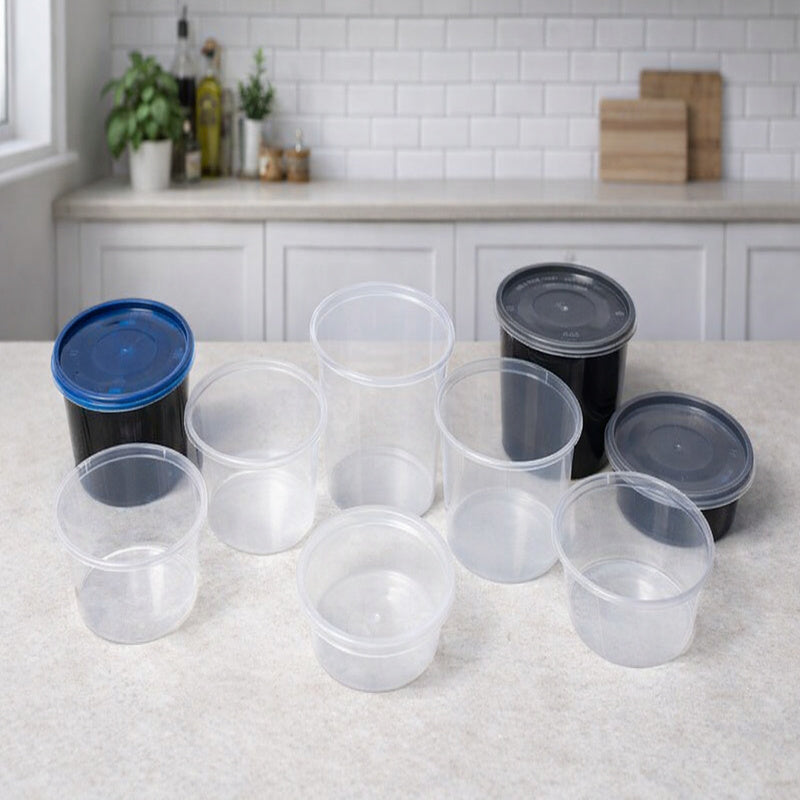 Set of clear plastic containers with lids on a kitchen counter