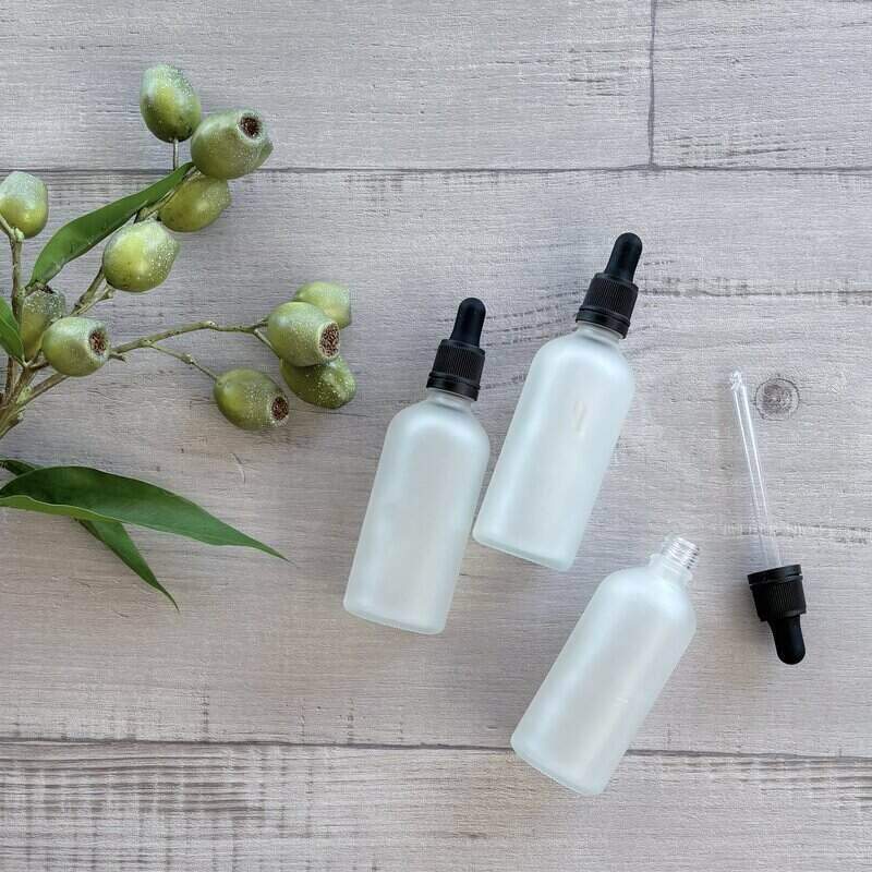 100ml Frosted Glass Bottle with Black Dropper x 3 with dropper next to bottle