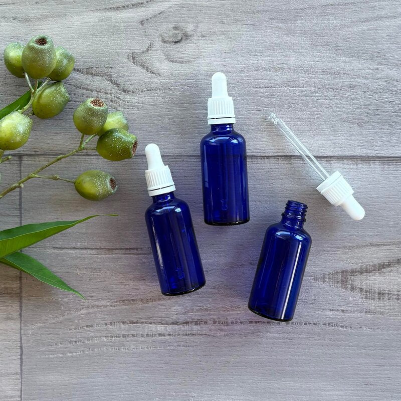 50ml blue bottle with white tamper evident dropper x 3 one dropper out of bottle next to others @ centaur packaging