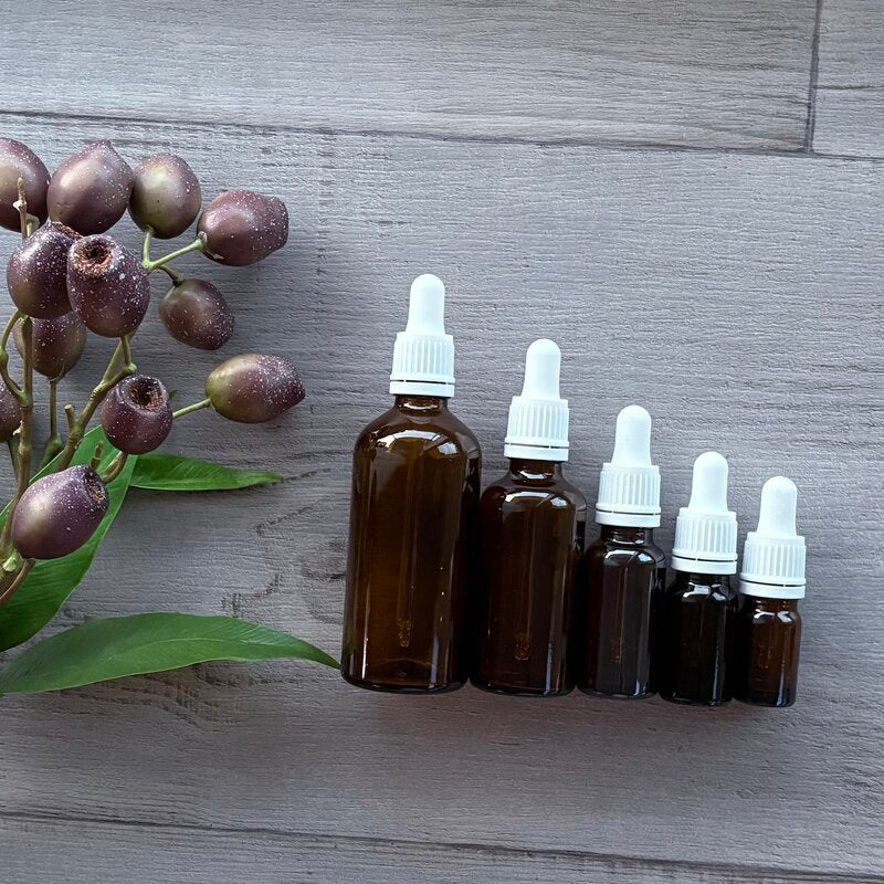 5 different sixed amber glass bottles with white tamper evident dropper