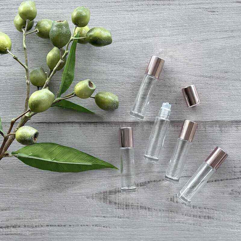 10ml Clear Glass Roller Bottle with Blush Lid - 5 Pack lid off