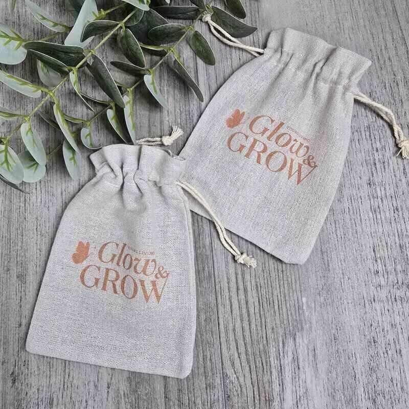 printed glow and grow drawstring back with grey background