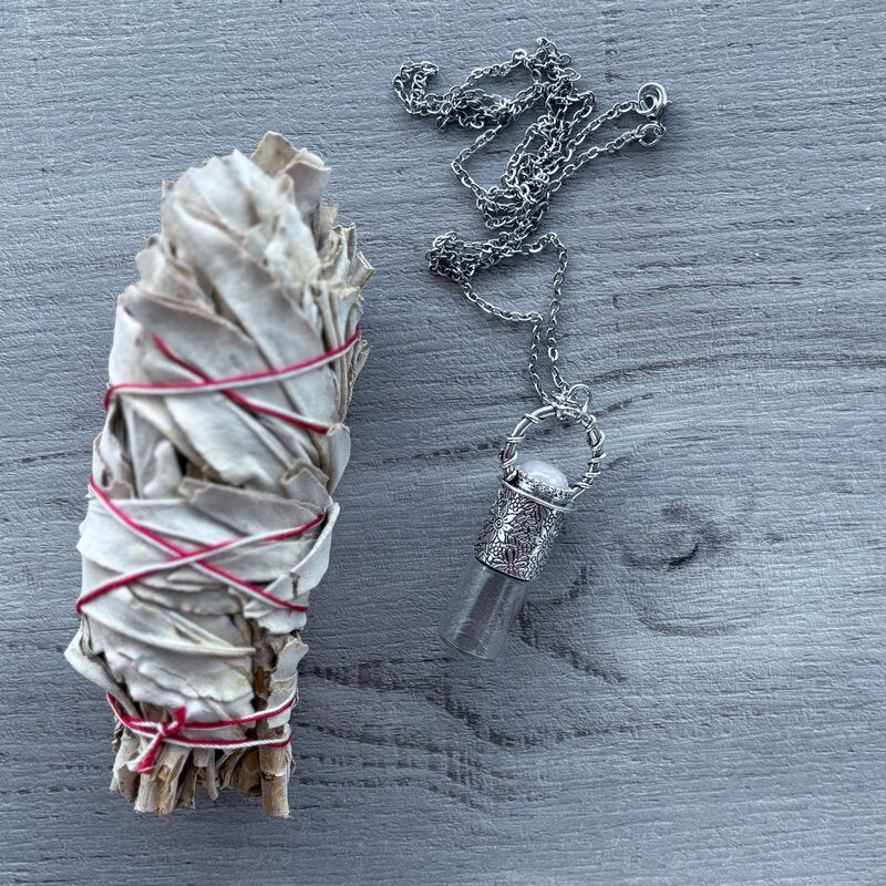 3ml clear glass roller with ornate silver lid with rose quartz crystal stone & silver chain necklace pictured with sage smudge stick