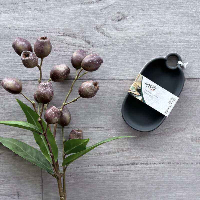 Appetito black silicone spoon rest for holding spoons, spatulas and ladles during cooking.