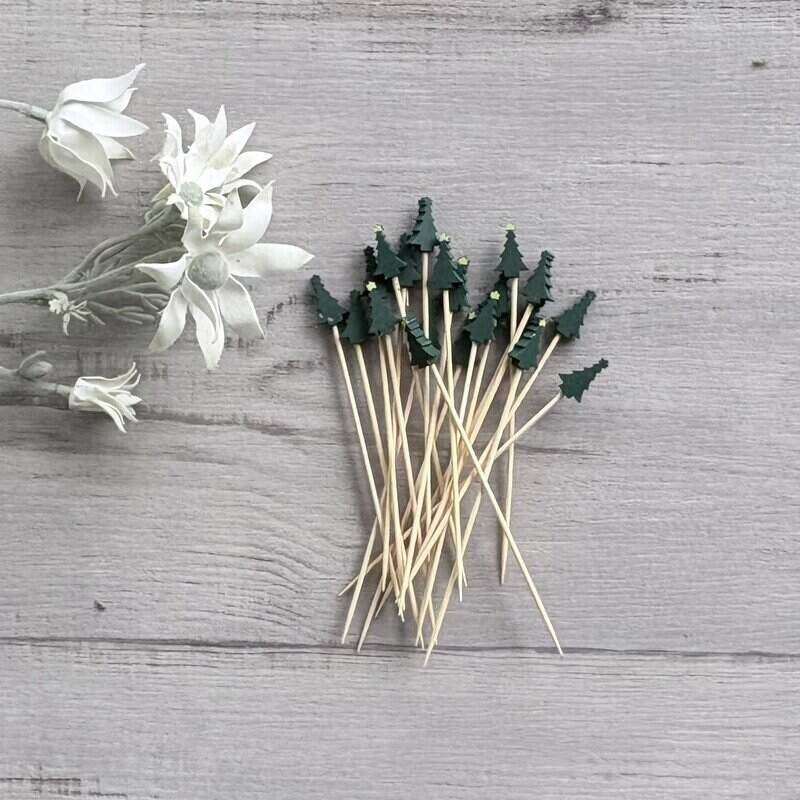 Value Craft green Christmas tree-shaped wooden skewers, 13.5cm long, supplied in a 20-piece pack for festive food presentation.