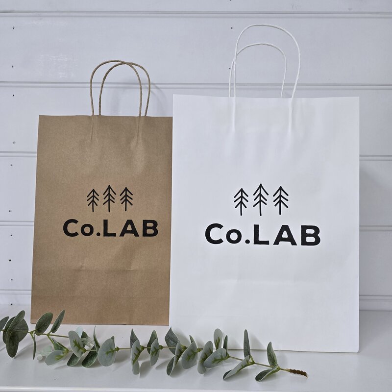 custom printed kraft and white paper bag with twisted handles @ centaur packaging Bomaderry