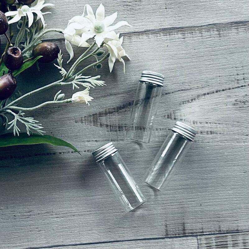 silver screw lid on glass clear test tube