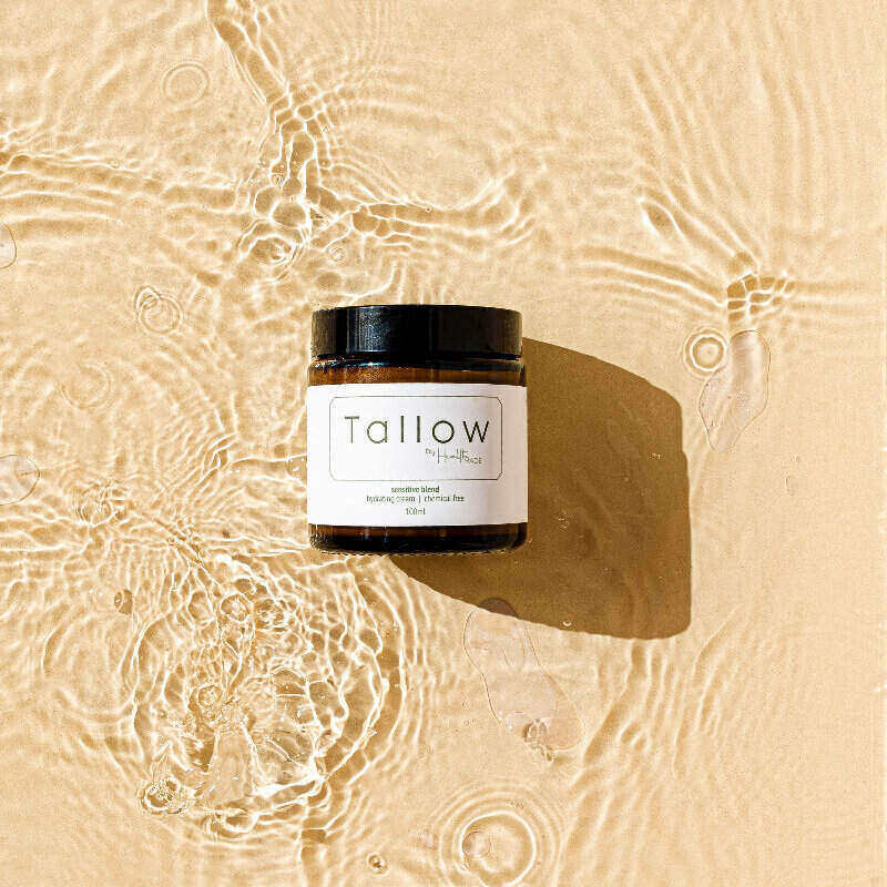 Tallow by health made 100ml amber jar on water and sand
