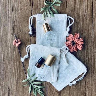 tint calico bag with drawstring x 3 with roller bottles on top