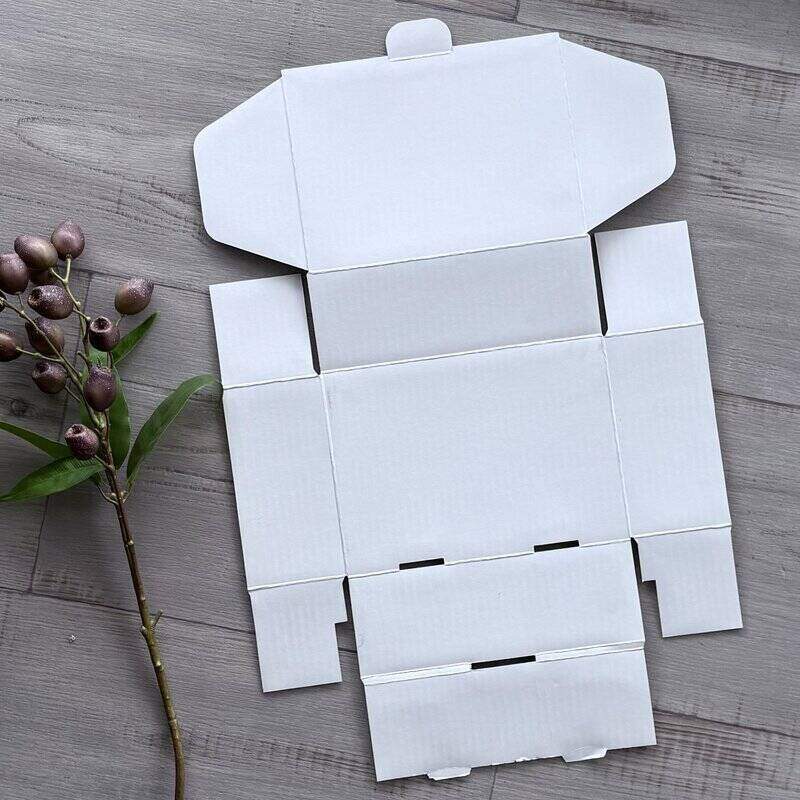 white mailing box small cardboad box flat