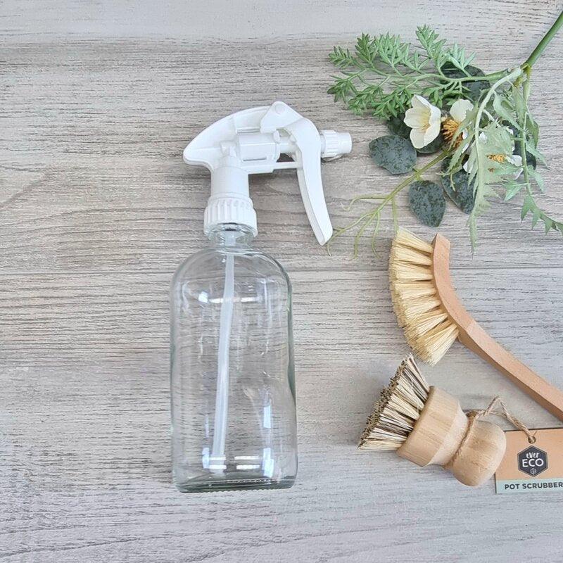 white trigger spray on clear glass bottle