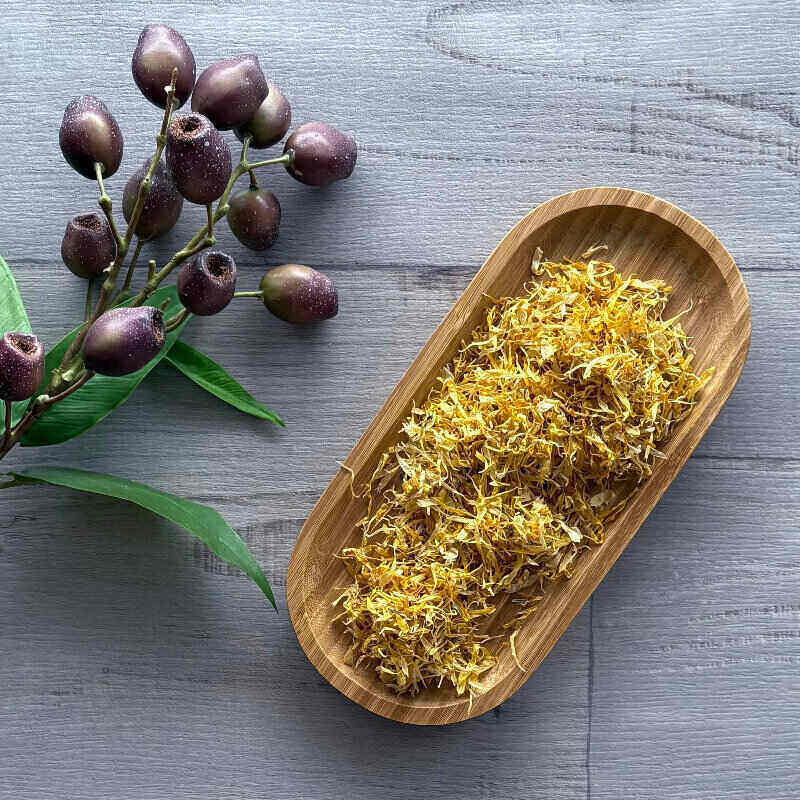 calendula flower on wooden board - centaur packaging